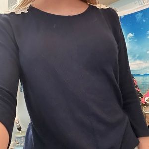 A very cute dark blue shirt with a cross pattern.